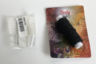 black thread and smaller needle